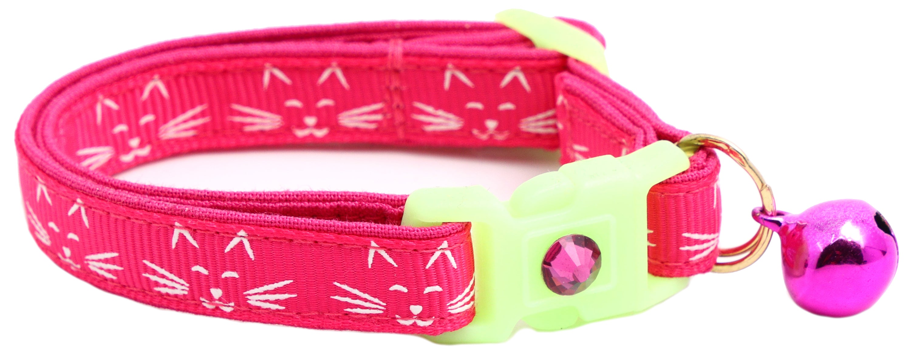 A glowing cat faces breakaway collar made of reinforced cotton, featuring a bell and charm, perfect for nighttime visibility.